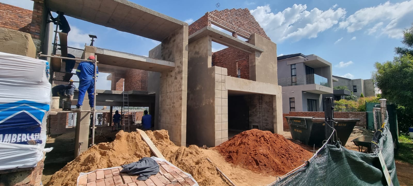 Bricklayers building a double-storey home’s structural walls on site